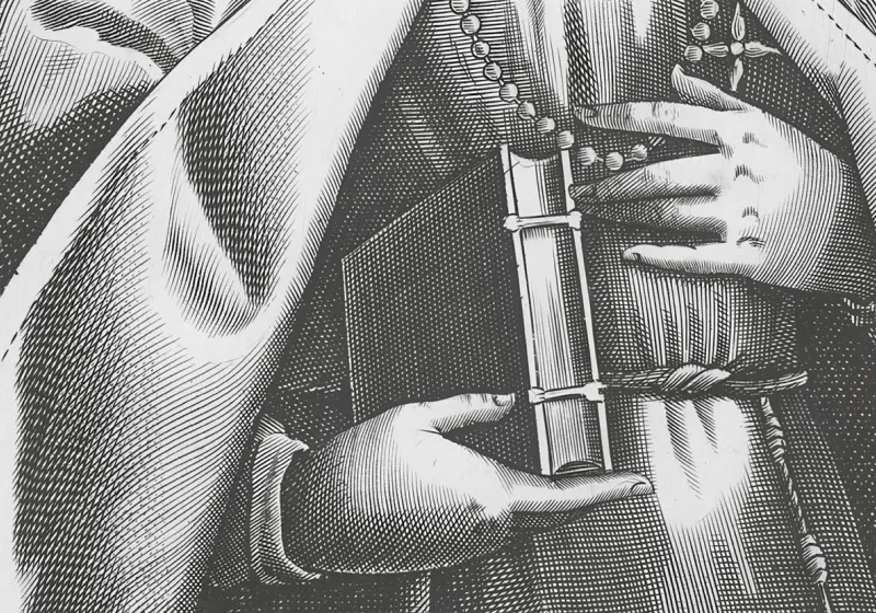 Religiós sostenint un llibre